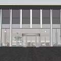 Modern Building Entrance Featuring Glass Curtain Walls Revolving Door And Metal Frames