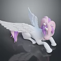 White Pony Toy With Purple Mane And Wings Lying On Black Surface With Reflection