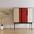 Modern Sideboard With Wooden Red And White Panels Black Legs And Potted Plant