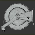 Industrial Metal Cable Reel With Handle And Worn Metallic Finish On Dark Background