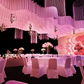 Banquet Hall Interior With Curved White Strip Ceiling And Pink White Flower Arrangements
