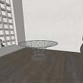 Modern Round Glass Top Coffee Table With Metal Mesh Base In Wooden Floor Room
