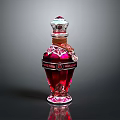 Elegant Red Crystal Perfume Bottle With Ornate Cap And Intricate Patterns