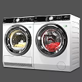 Two Front Load Washing Machines with Clothes Inside White Body Black Panel 3d model