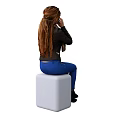 Woman in Black Leather Jacket Plaid Scarf Blue Skinny Jeans Black Boots on White Cube