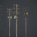 Old Weathered Wooden Utility Poles With Crossarms And Hanging Power Lines