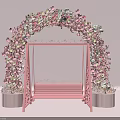 Pink Floral Arch With Bench And Decorative Flowers Design Setup