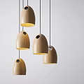 Modern Wooden Egg Shaped Pendant Lights With Holes Hanging In Interior Decor