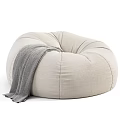 Comfortable Beige Bean Bag Chair With Gray Blanket For Cozy Living Room