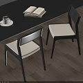 Black Frame Dining Chairs With White Cushion On Wooden Floor Featuring Open Book And Coffee