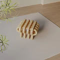 Modern Wooden Side Table with Geometric Curved Design and Green Plant on Beige Mat