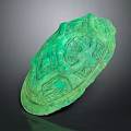 Green Jade Jewelry Piece With Intricate Carved Patterns And Ornate Design Details