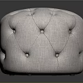 Round Tufted Ottoman With Light Fabric Upholstery And Simple Modern Design