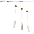 Modern Golden Cylindrical Pendant Lights With Glass Accents Hanging From Ceiling