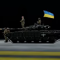 Ukrainian Military Tank With Soldiers And National Flag On