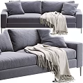 Gray Upholstered Two Seater Sofa With Soft Pillows And Knit Blanket