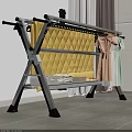 Metal Clothes Drying Rack With Yellow Quilt Pink Dress And Green Clothes Indoor