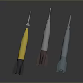 Three Different Colored Rocket Weapons with Yellow White Blue Bodies and Thrusters