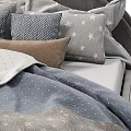Modern Bedroom Setup With Upholstered Bed Frame And Decorative Pillows