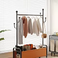 Indoor Garment Rack With Hanging Sweaters Coats And Storage Basket For Bags