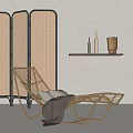 Wicker Lounge Chair With Pillows And Blanket Near Rattan Screen And Wall Shelf