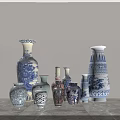 Blue And White Ceramic Vases With Traditional Patterns Displayed On Gray Marble Countertop
