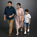 Smiling Parents and Son Walking Hand in Hand Together on Gray Background