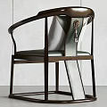 Modern Single Chair With Dark Brown Metal Frame And Light Colored Cushion In Minimalist Interior