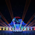 Amusement Park Nighttime Light Show With Colorful Projections