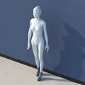 White Human Sculpture Standing Against Blue Wall With Light Colored Floor and Shadow Projection