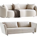 Modern Light Colored Sofa Set With Curved Design Cushions Throw Blanket And Sleek Metal Legs