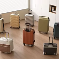Various Colored Suitcases With Trolley Handles And Rolling Wheels In Modern Room