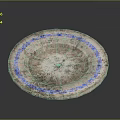Hand Carved Circular Stone Sculpture With Blue Rim And Textured Surface