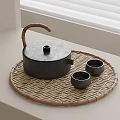 Minimalist Black Tea Set with Bamboo Handle Woven Tray and Small Teacups on White Windowsill