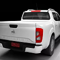 White Nissan Pickup Truck Front View With Chrome Grille And Alloy Wheels