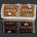 Decorative Gingerbread House With White And Blue Frosting Snowflake Leaf Patterns