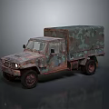 Vintage Rusty Military Truck With Camouflage Paint And Canvas Covered Cargo Bed