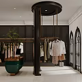 Modern Clothing Store Interior With Black Walls Hanging Clothes Black Pillar And Green Potted Plant