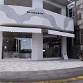 Modern Shop Front Desk With Coffee Machine Bar Counter White Chairs Green Plants And Round Light