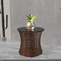 Round Side Table With Woven Rattan Base Black Tabletop And Green Plant Vase