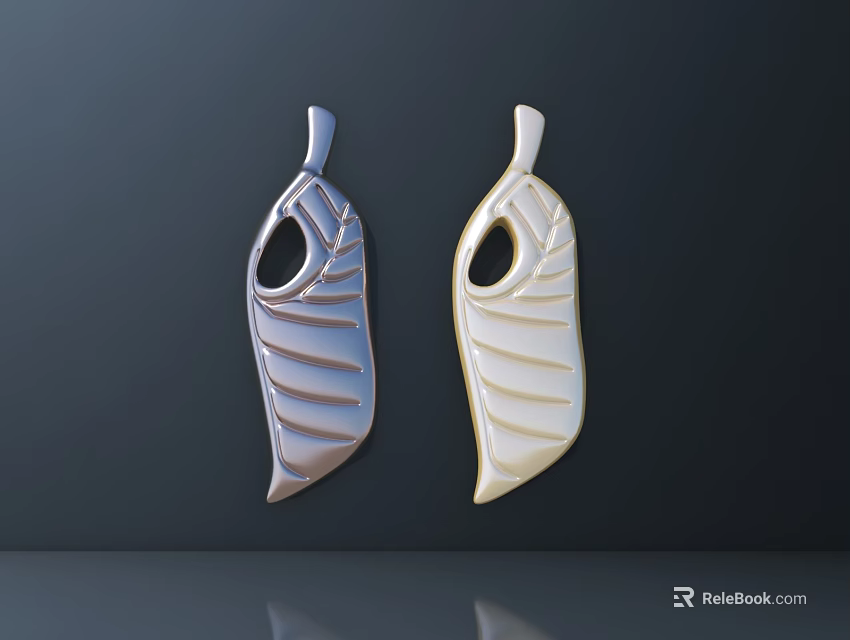 Silver And Gold Leaf Shaped Pendants With Textured Design On Dark Background 3d model
