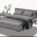 Modern Double Bed With Soft Linens Nightstands And Decorative Items On Rug