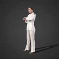 Woman Wearing White Suit Standing with Hands Crossed Against Gray Background