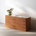 Brown Wooden Chest of Drawers with Marble Top and Decorative Green Vase with Flowers