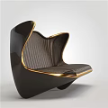 Modern Sculptural Single Chair With Black Frame Gold Accents And Streamlined Design