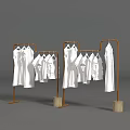 Art Installation With Brown Metal Frames Holding White Garments And Wooden Bases On Gray Background