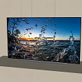 High Definition Television Showing Vibrant Water Splash Scene and Sunset Landscape