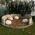Round Outdoor Landscape Seats With White Spotted Spheres Gravel And Green Plants