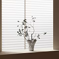 Textured Vase with Flowering Branches and Small Berries on Windowsill by Window Blinds