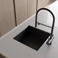 Modern Black Vegetable Sink In Kitchen With Sleek Faucet And White Countertop
